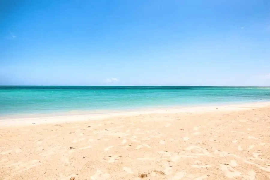 Empty white sand beach and turquoise water at Burwood